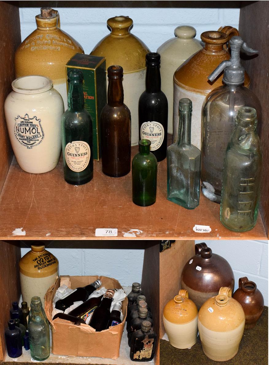 Lot 78 - A quantity of antique glass and stoneware bottles with some advertising examples, including a large