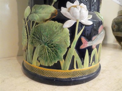 Lot 79 - George Jones majolica stick stand moulded with water lilies and fish impressed mark, 55cm high