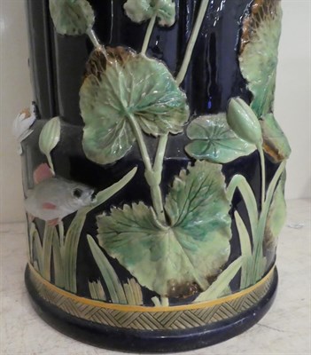 Lot 79 - George Jones majolica stick stand moulded with water lilies and fish impressed mark, 55cm high