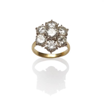 Lot 603 - An 18 Carat Gold Diamond Cluster Ring, seven round brilliant cut diamonds arranged in white...