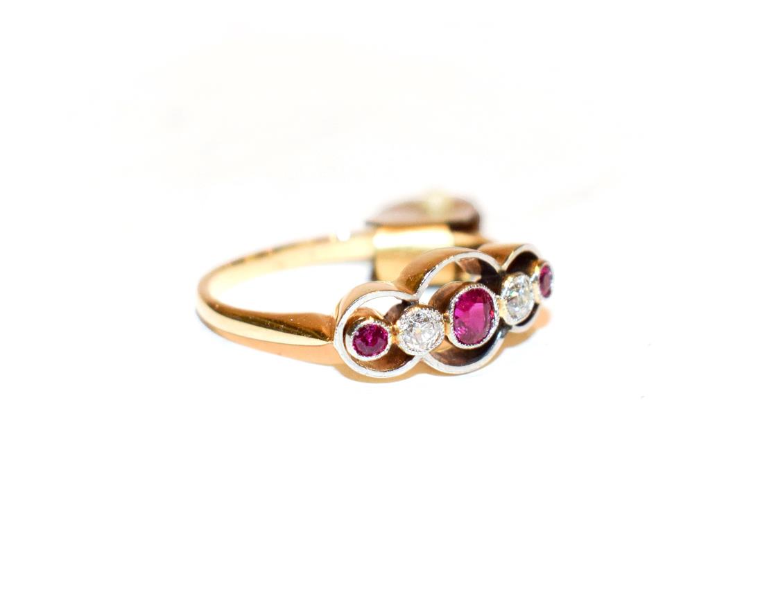 Lot 100 - A synthetic ruby and diamond five stone ring, three graduated round cut rubies alternate with...