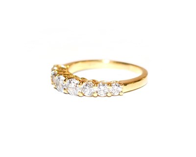 Lot 105 - A diamond eight stone ring, the graduated round brilliant cut diamonds, in yellow claw settings, to