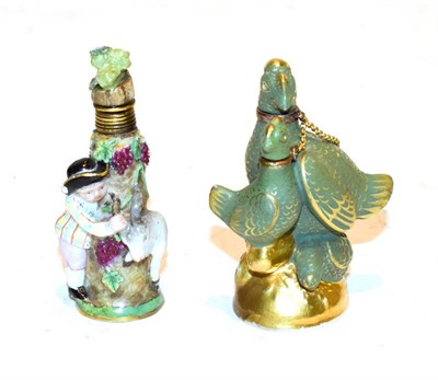 Lot 116 - A 19th century Meissen scent bottle, formed as a boy wearing a tricorn hat chasing a goat,...