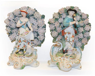 Lot 143 - A pair of early 19th century Derby figures modelled as a Shepherd and his companion, each stood...