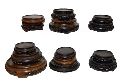 Lot 147 - A quantity of Chinese carved hardwoood stands including 19th century examples (one tray)