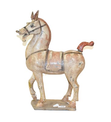Lot 158 - A Chinese terracotta figure of a horse, in the style of the Tang dynasty, modelled with...
