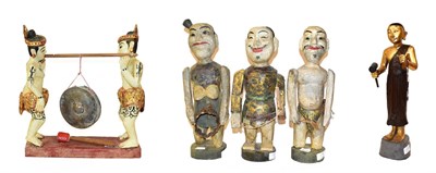 Lot 159 - A set of three Chinese painted carved wooden figures of musicians, with articulated limbs, 41cm...