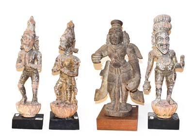 Lot 163 - A set of three Indian carved giltwood figures, on later bases, largest 60cm high, together with...