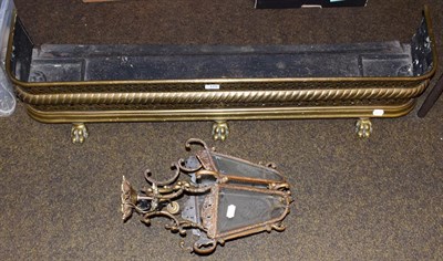 Lot 171 - A hanging light fitting of lantern form and a Victorian brass fire fender, 120cm wide, 32cm deep