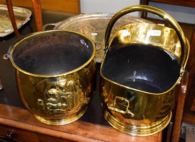 Lot 200 - A brass helmet form coal scuttle and a early 20th century embossed coal scuttle (2)