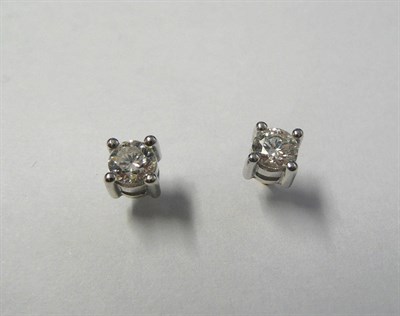 Lot 615 - A Pair of 18 Carat Gold Diamond Solitaire Stud Earrings, each round brilliant cut diamond in a...