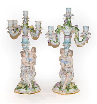Lot 208 - Two 19th century German porcelain figural five branch candelabra, decorated in coloured...
