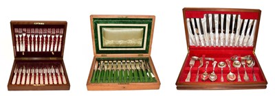 Lot 211 - A mahogany cased set of twelve dessert knives and forks with mother of pearl handles, another...