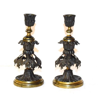 Lot 221 - A pair of late 19th century parcel gilt bronze candlesticks 19cm (2)