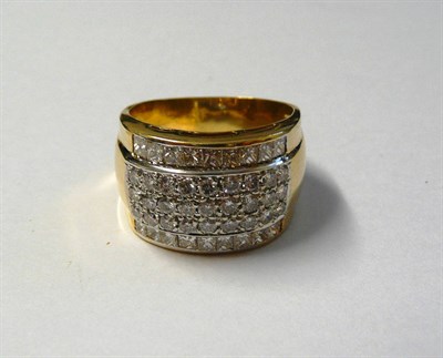 Lot 617 - A Diamond Ring, a central band of three rows of pavé set brilliant cut diamonds within a row...