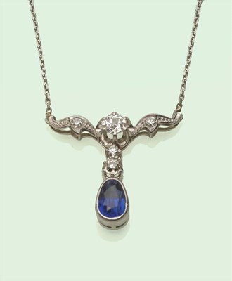 Lot 620 - A Sapphire and Diamond Necklace, a pear shaped sapphire suspended from old cut diamonds, to...