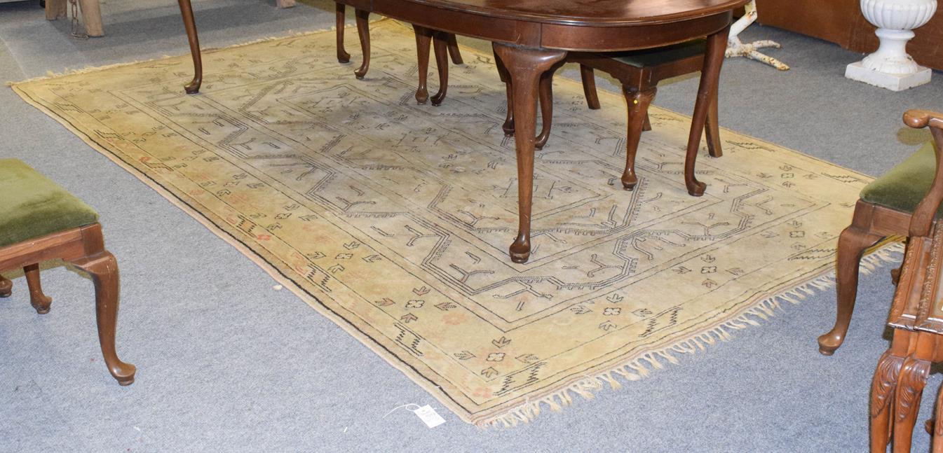 Lot 1072 - A Melas carpet, the narrow field of cruciform devices enclosed by multiple borders, 323cm by 202cm