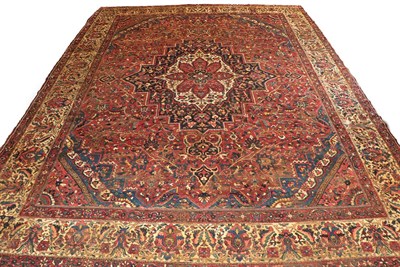 Lot 1087 - Large Bakhtiari carpet, west Iran circa 1920. The deep madder field of angular vines around an...