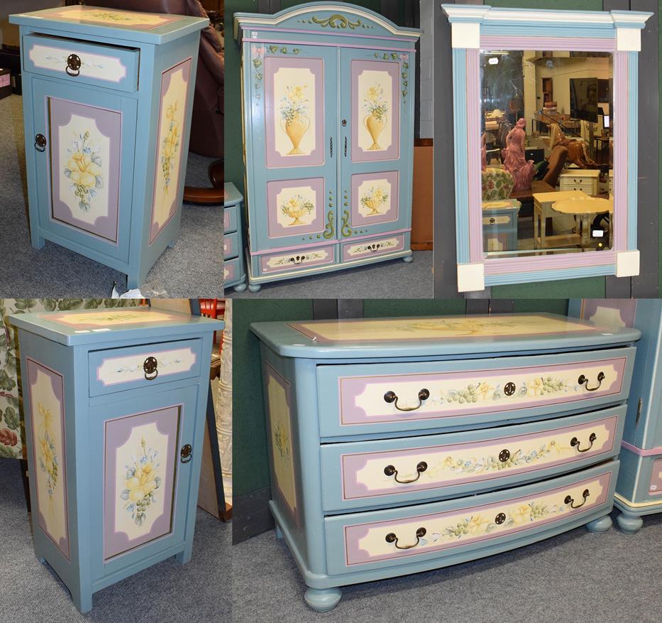 Lot 1090 - A painted pine five piece bedroom suite in blue and lilac decorated with flowers, comprising a...