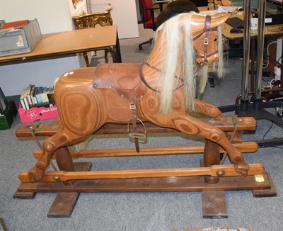 Lot 1097 - A 20th century rocking horse on trestle base bearing plaque for Colin Grimmitt, Rocking Horse Maker