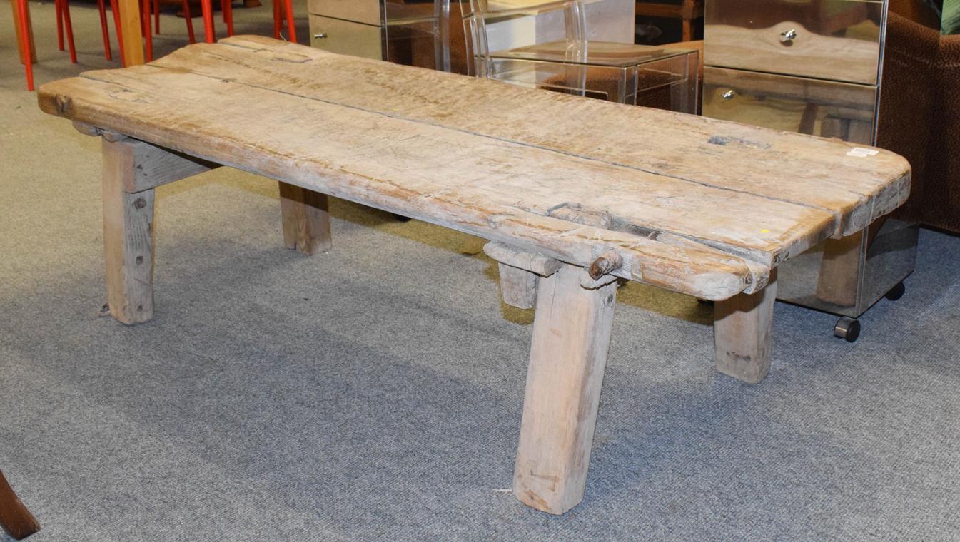 Lot 1098 - A 19th century elm pig bench, 168cm by 64cm by 45cm