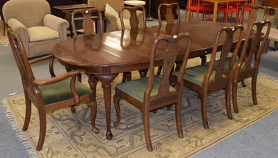 Lot 1099 - A set of eight walnut Queen Anne style dining chairs including two carvers together with a...