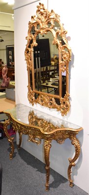 Lot 1104 - A modern mirrored gilt composition console table, 146cm by 48cm by 83cm in the rococo taste...