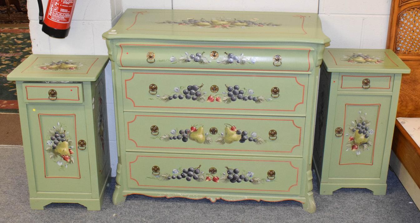 Lot 1120 - A three piece green painted pine bedroom suite decorated with fruit, comprising a four height chest