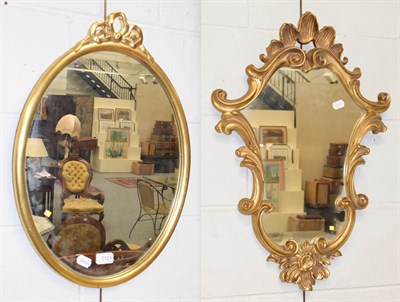 Lot 1123 - A modern ribbon tied gilt framed oval mirror, 40cm by 57cm, together with another gilt mirror...