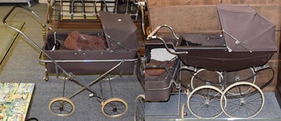 Lot 1130 - A large Silvercross pram, a smaller example and a cradle (3)