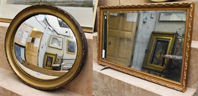 Lot 1134 - An oval convex mirror 59cm by 49cm and a hand bevelled mercury plate mirror 107cm by 64cm (2)