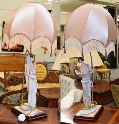 Lot 1136 - A pair of Capo de Monte figural composite table lamps, formed as maidens, 50cm high