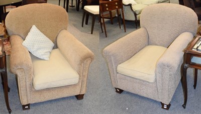 Lot 1139 - A pair of upholstered armchairs, raised on mahogany block feet (2)