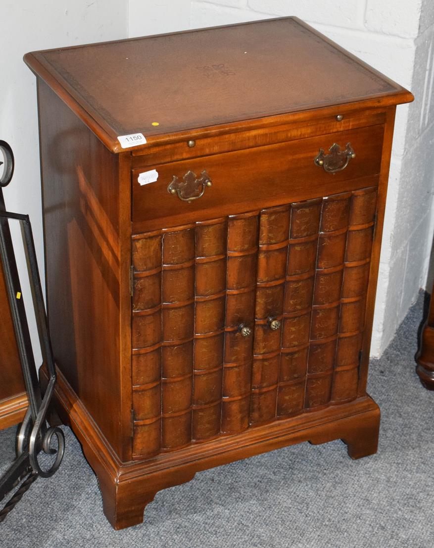 Lot 1150 - A modern low cupboard, the two cupboard doors in the form of bookends and also fitted with a drawer