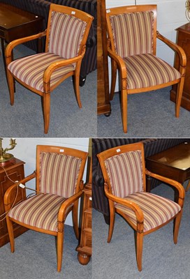 Lot 1152 - A set of four hardwood part upholstered open armchairs