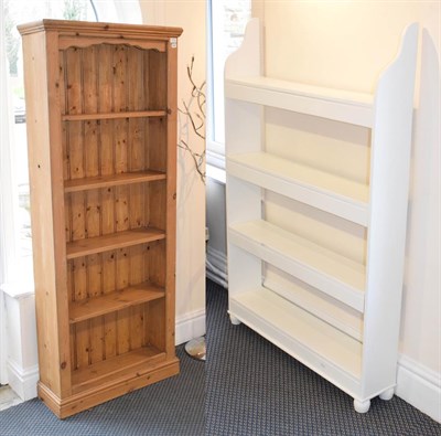 Lot 1171 - A pine open bookcase 76cm by 24cm by 181cm, together with a white painted four tier open bookcase