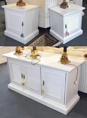 Lot 1172 - A white painted three door sideboard 153cm by 52cm by 78cm together with a pair of matching low...