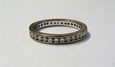 Lot 636 - A Diamond Eternity Ring, the round brilliant cut diamonds in a white channel setting, total diamond