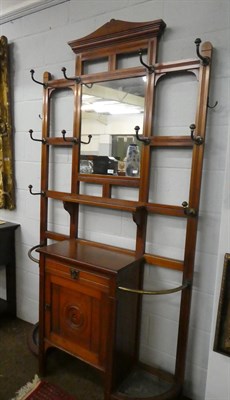 Lot 1195 - A Victorian mahogany hall stand, with mirrored back and brass fittings, 114cm by 220cm