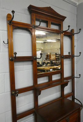 Lot 1195 - A Victorian mahogany hall stand, with mirrored back and brass fittings, 114cm by 220cm