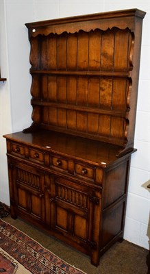 Lot 1198 - A carved oak priory style Titchmarsh & Goodwin dresser with plate rack, 107cm by 45cm by 180cm
