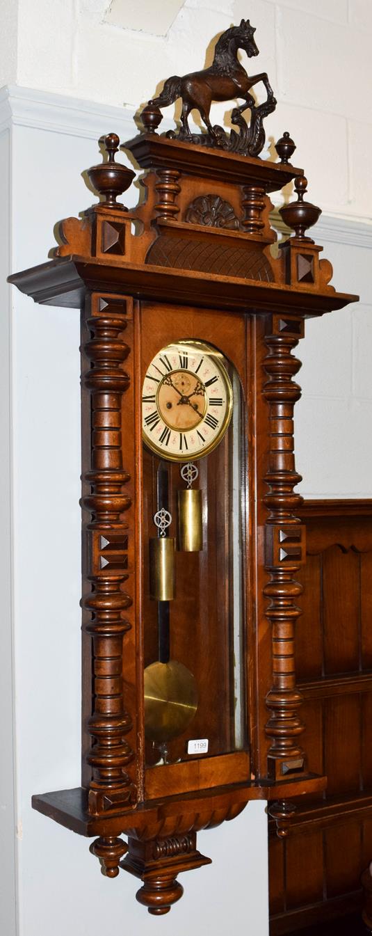 Lot 1199 - A Victorian Vienna type double weight driven wall clock, circa 1890, 120cm high