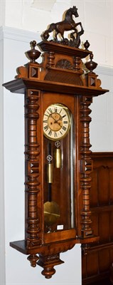 Lot 1199 - A Victorian Vienna type double weight driven wall clock, circa 1890, 120cm high