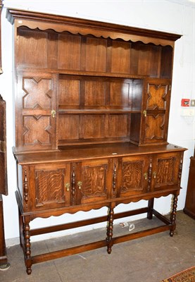 Lot 1201 - An early 20th century oak dresser and rack, 157cm by 47cm by 200cm