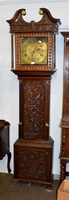 Lot 1202 - A carved oak thirty hour longcase clock, the square brass dial signed Ewbank, Elland
