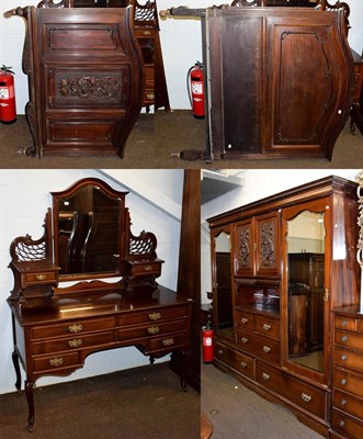 Lot 1204 - A Victorian mahogany three-piece bedroom suite comprising a gentleman's carved fitted triple...