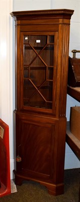 Lot 1209 - A reproduction mahogany standing corner cabinet with astragal glazed top section, 184cm