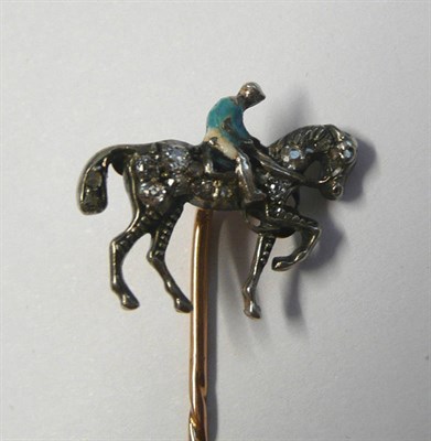 Lot 639 - A Horse and Jockey Stick Pin, the horse set with old cut diamonds throughout, the jockey astride in