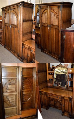 Lot 1215 - A four piece Old Charm linen fold bedroom suite comprising two wardrobes, mirror backed...