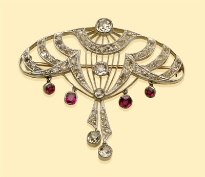 Lot 640 - An Art Deco Diamond and Ruby Brooch, of curved openwork form, set throughout with old cut and...